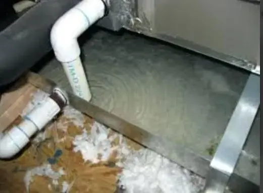 Ceiling stain under an overflowing attic AC condensate pan in Cedar Park