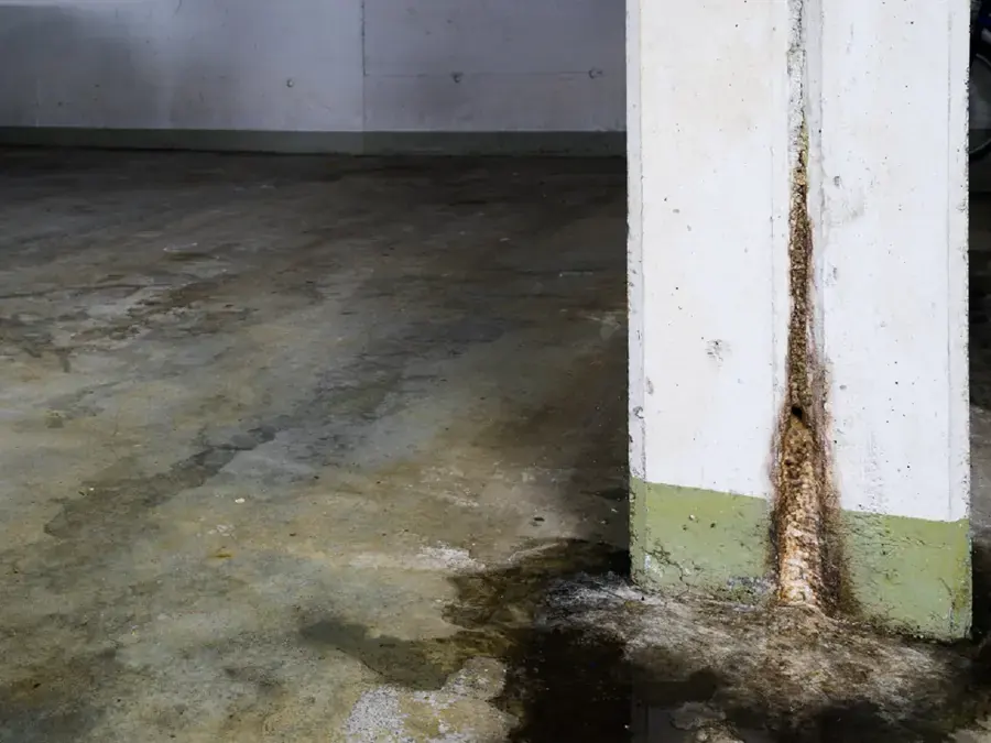 Storm water seeping in along the slab edge of a Cedar Park home